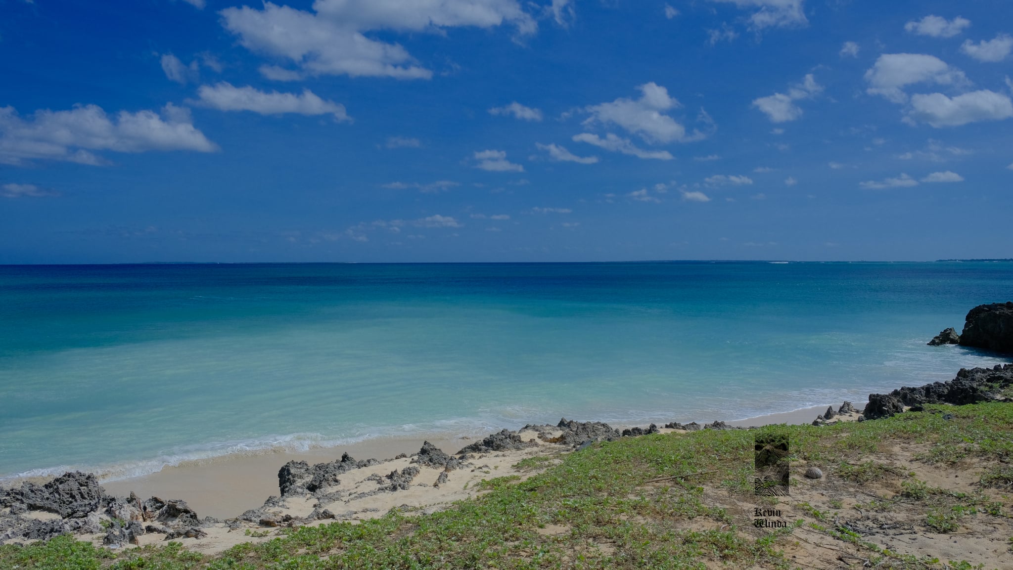 Rote Island beach, ocean blue water, coastal rocks | Kevin Winda Wellness